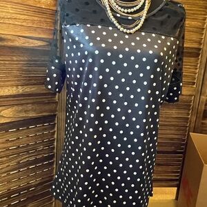 Adorable polka dot top. Never been worn. No tag, but guessing XL